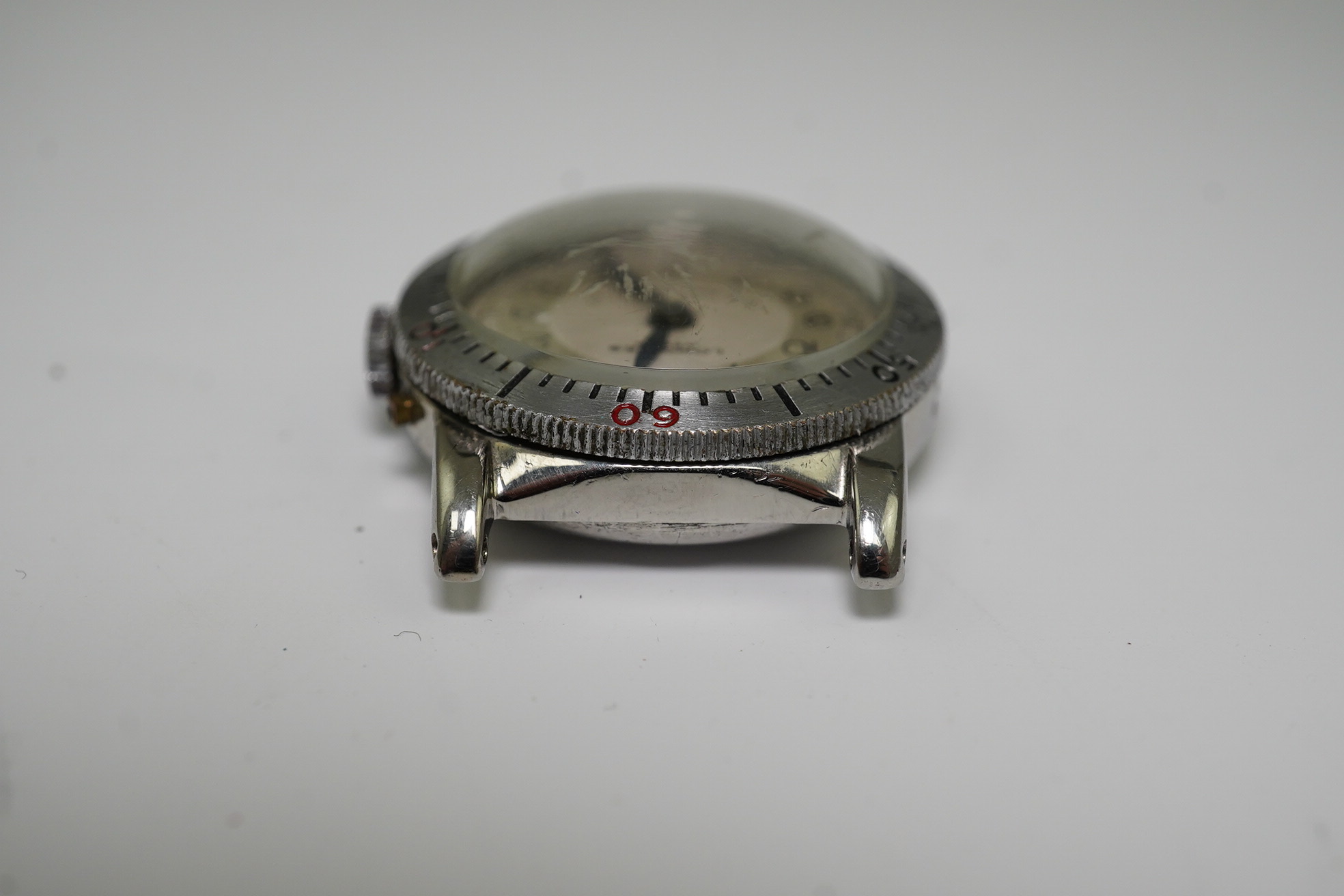 A gentleman's late 1930's steel Longines Weems U.S Patent military pilot's manual wind wrist watch, with Arabic dial, movement c.10L, case diameter 28mm, lacking one crown, no strap. Condition - poor